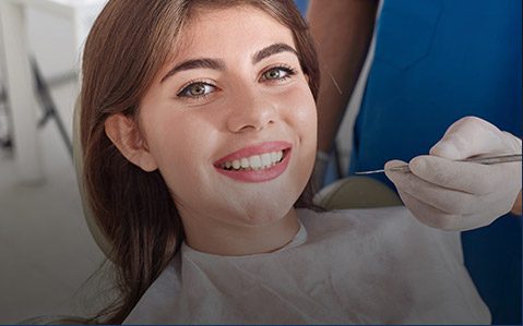 Woman receiving dental exam