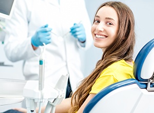 woman in dental chair smiling