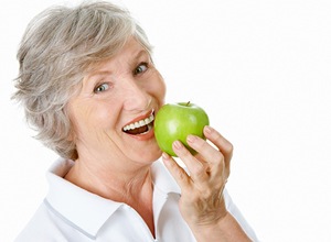 older woman with apple