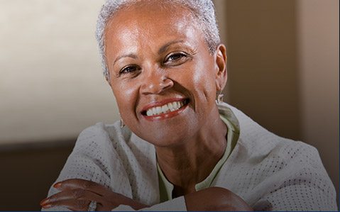 Woman with straight, white teeth smiling