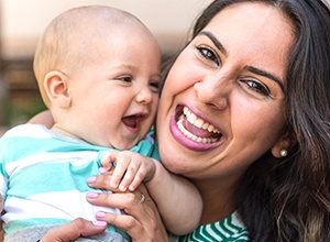 Fairfield preventive dentistry woman with baby smiling