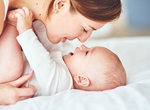 mother playing with the baby