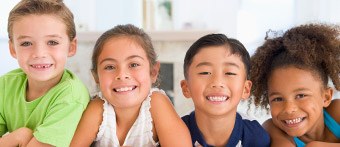 four kids smiling